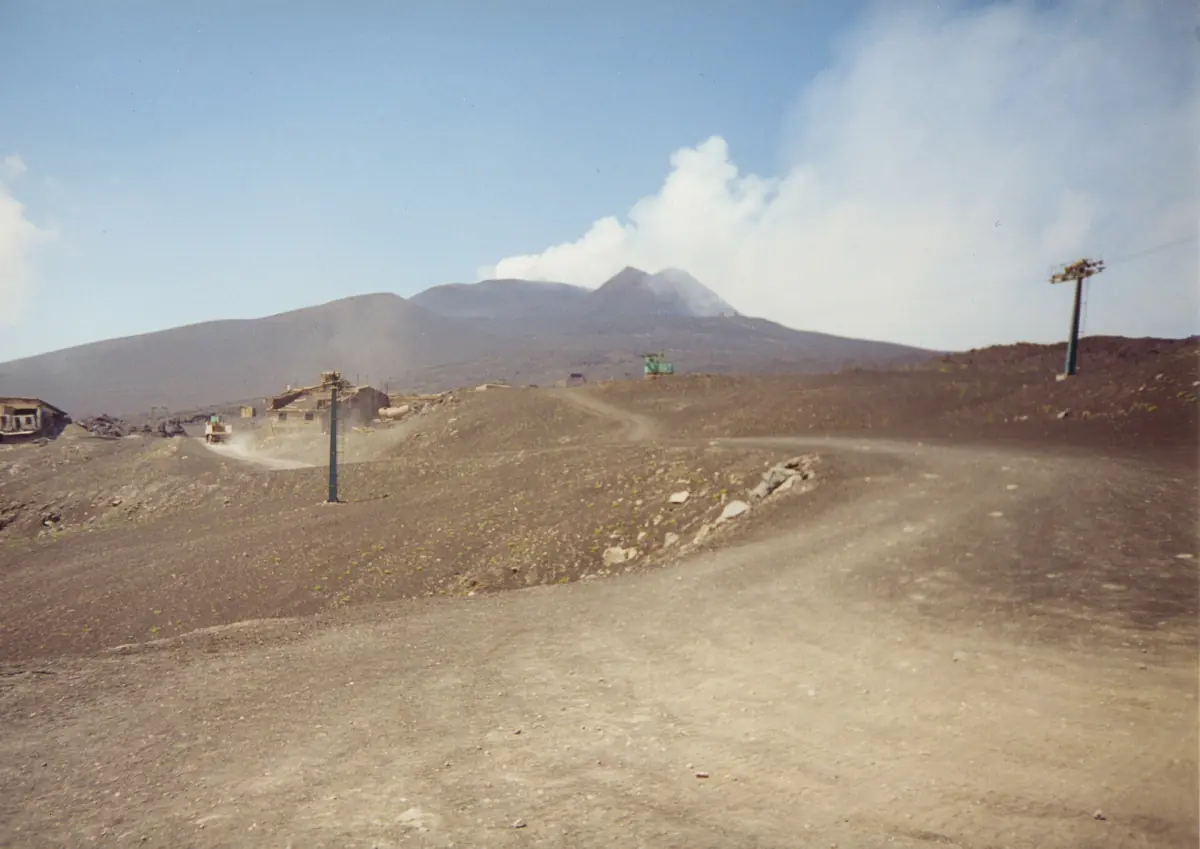 Lift pylons and tracks below the summit of Etna